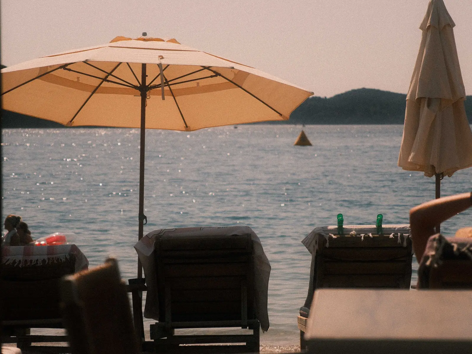 Sun loungers and umbrellas on a Greek beach