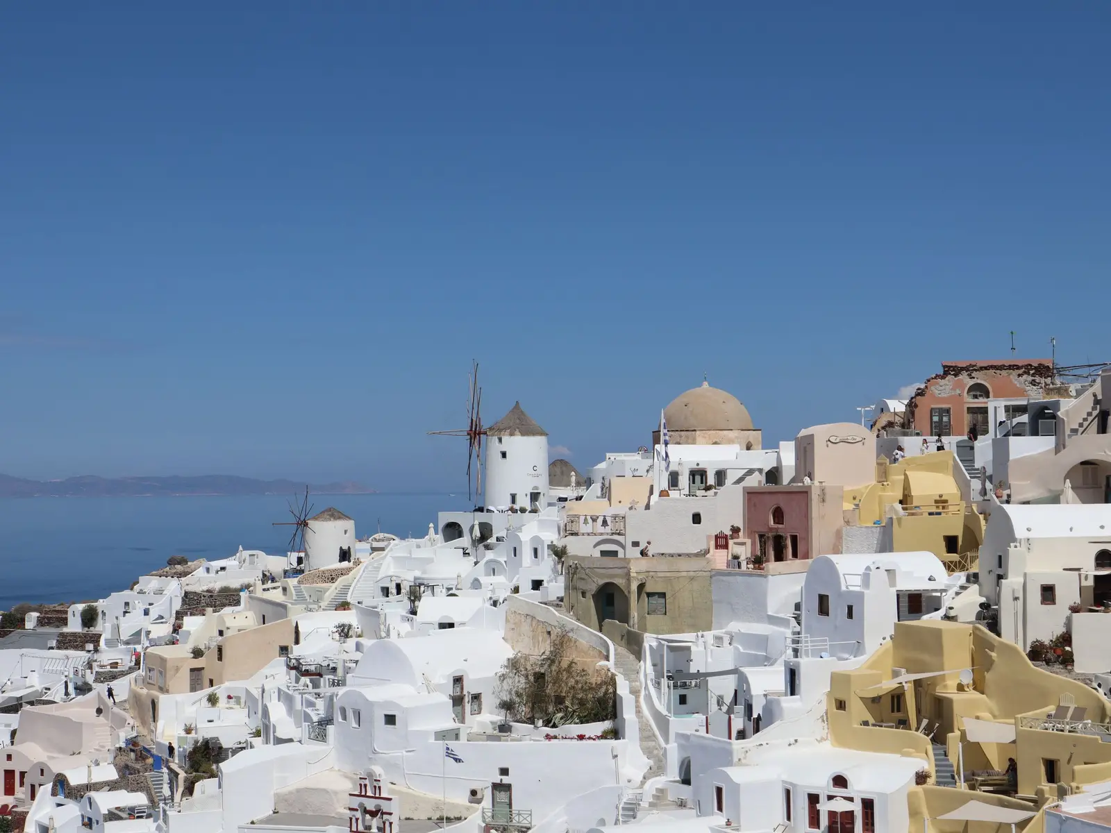 White houses on the cliffs above the sea in Oia, Santorini